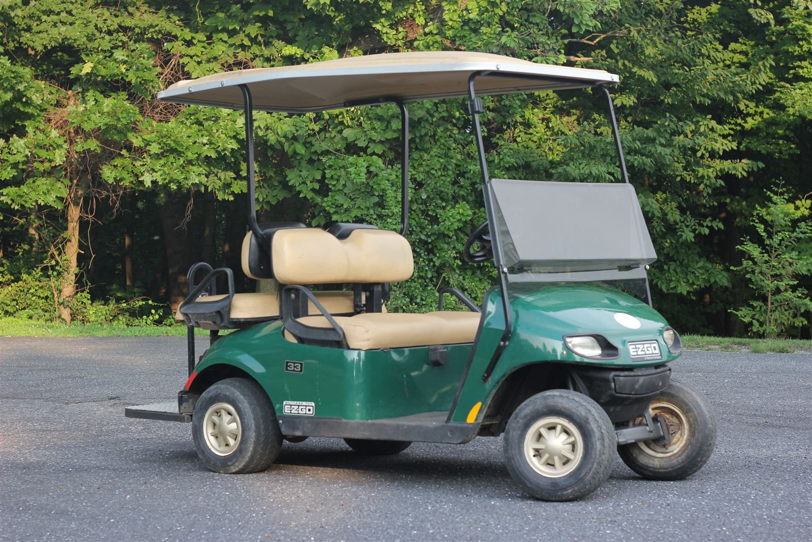 Hunter green EZGO Shuttle 2+2 custom golf cart